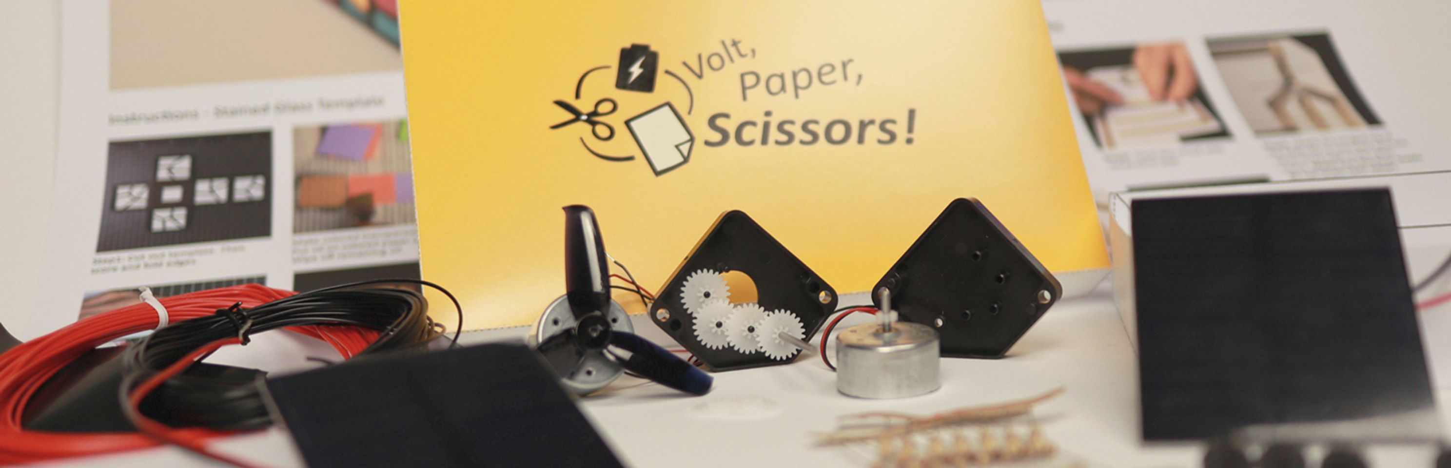 Hintergrundbild der Organisation Volt, Paper, Scissors!